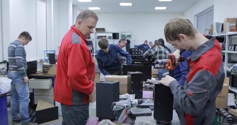 Workers in a Russian crypto mining center.